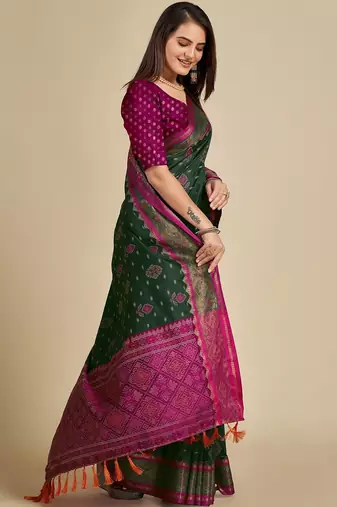 Dark green woven self design embellished pure silk patola saree with blouse