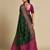 Dark green woven self design embellished pure silk patola saree with blouse