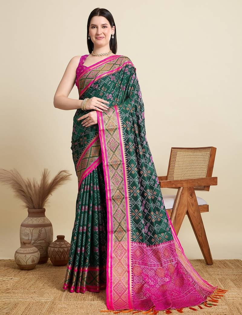 Green woven self design embellished pure silk patola saree with blouse