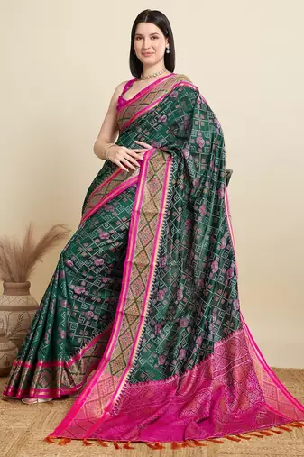 Green woven self design embellished pure silk patola saree with blouse