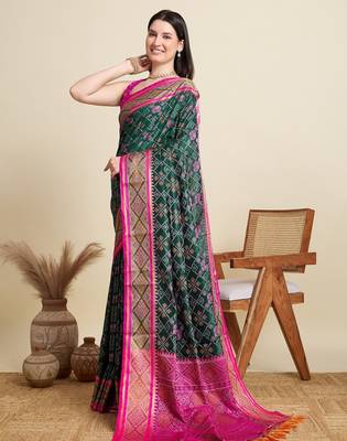 Green woven self design embellished pure silk patola saree with blouse 3