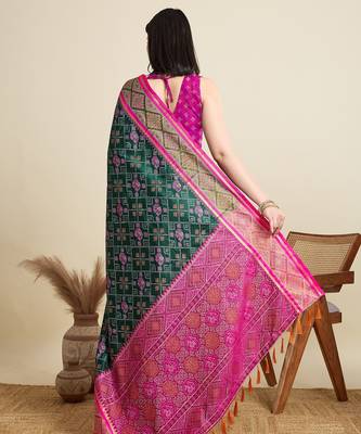 Green woven self design embellished pure silk patola saree with blouse 4