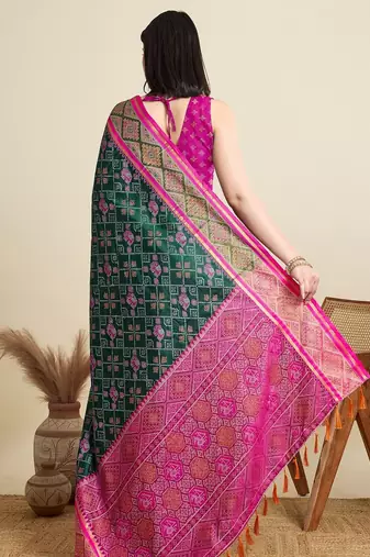 Green woven self design embellished pure silk patola saree with blouse