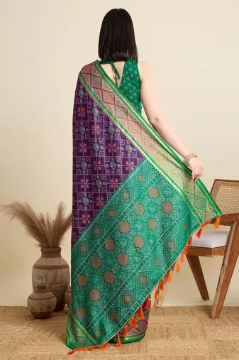 Purple woven self design embellished pure silk patola saree with blouse