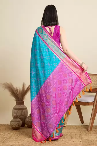 Teal blue woven self design embellished pure silk patola saree with blouse