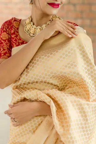 Beige red silk blend banarasi saree with unstitched blouse piece