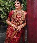 Red silk blend banarasi saree with unstitched blouse piece