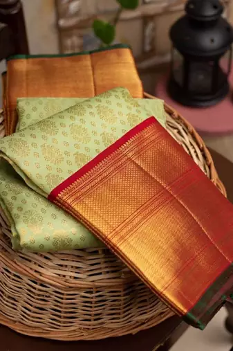 Light green red silk blend banarasi saree with unstitched blouse piece