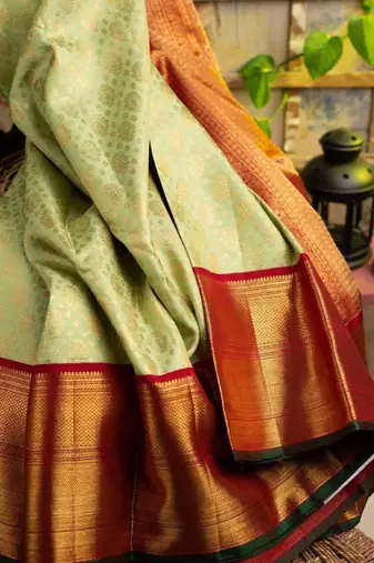 Light green red silk blend banarasi saree with unstitched blouse piece