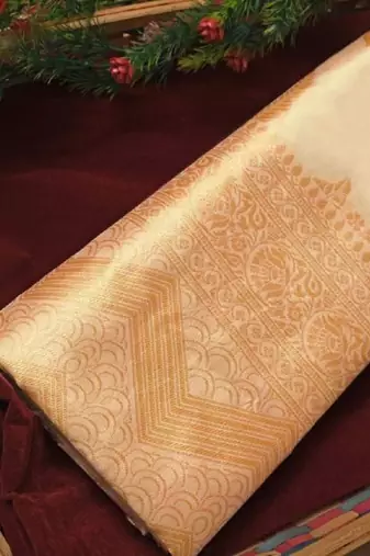 Off white silk blend banarasi saree with unstitched blouse piece