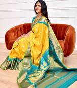 Yellow turquoise silk blend banarasi saree with unstitched blouse piece