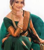 Green silk blend banarasi saree with unstitched blouse piece
