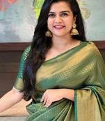 Green silk blend banarasi saree with unstitched blouse piece