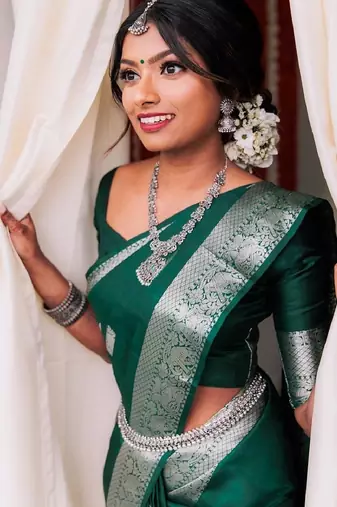 Green silk blend banarasi saree with unstitched blouse piece