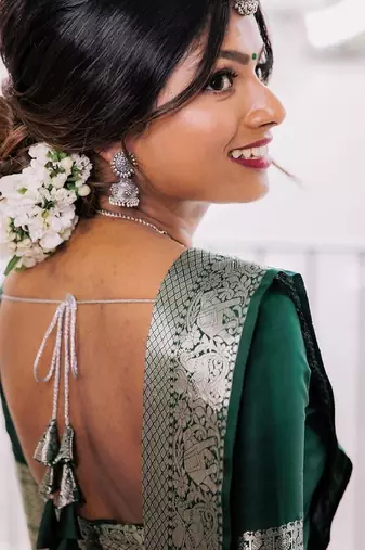Green silk blend banarasi saree with unstitched blouse piece