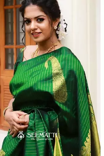Green silk blend banarasi saree with unstitched blouse piece