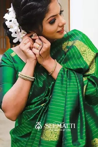 Green silk blend banarasi saree with unstitched blouse piece