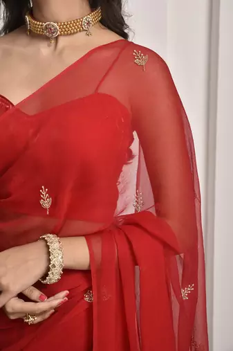 Red hand embroidered chiffon saree
