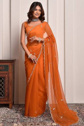 Rust hand embellished mukaish work chiffon saree