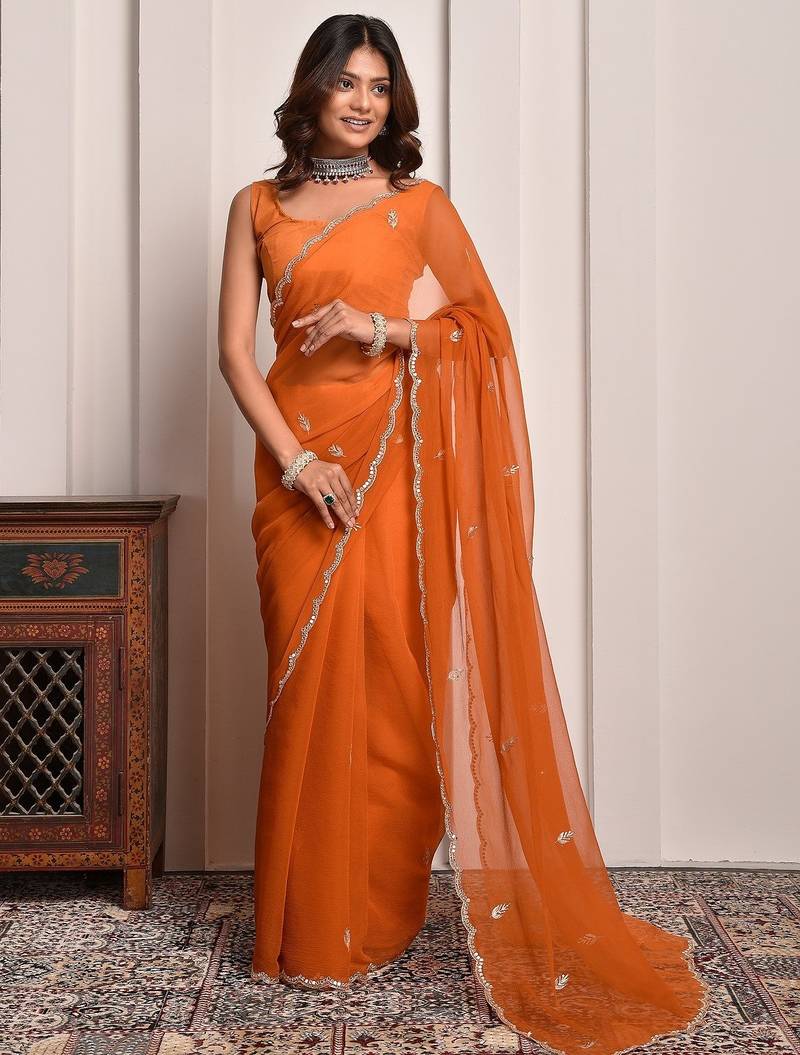Rust hand embellished mukaish work chiffon saree