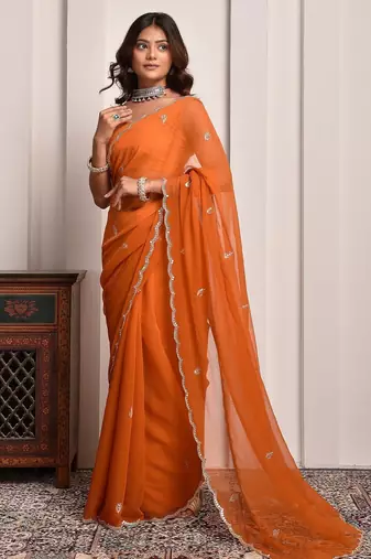 Rust hand embellished mukaish work chiffon saree