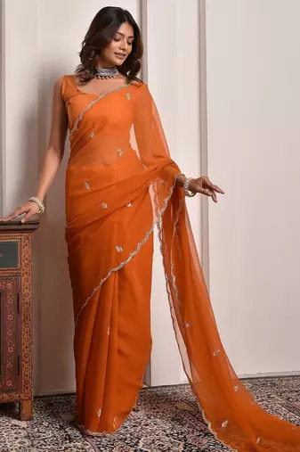 Rust hand embellished mukaish work chiffon saree