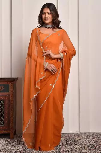 Rust hand embellished mukaish work chiffon saree
