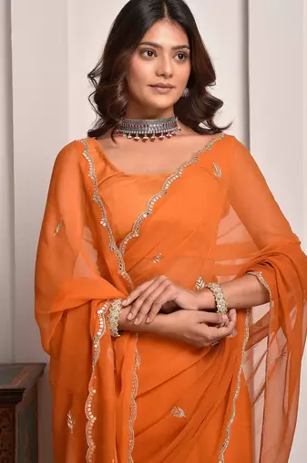 Rust hand embellished mukaish work chiffon saree