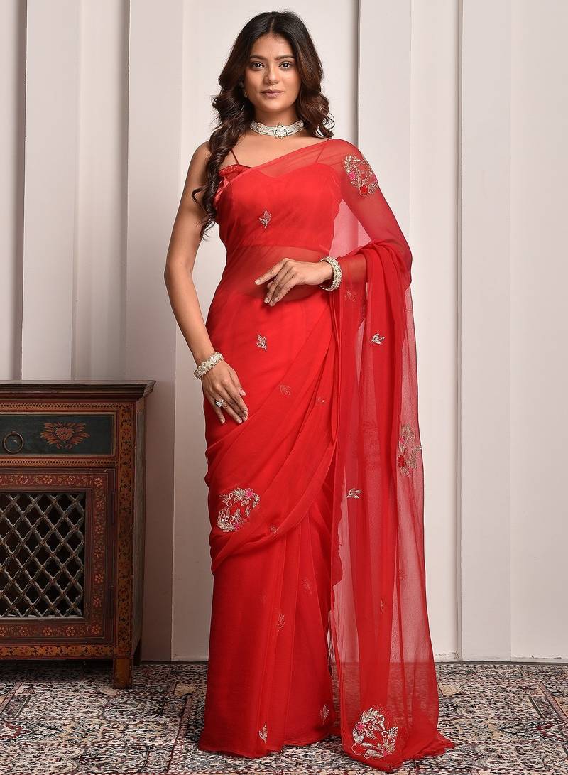 Red shaded hand embellished chiffon saree