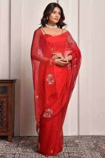 Red shaded hand embellished chiffon saree