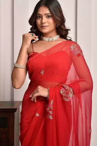 Red shaded hand embellished chiffon saree