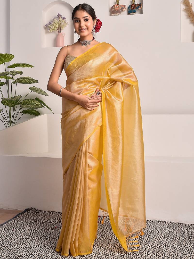 Mustard yellow tissue saree with unstitched blouse piece