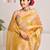 Mustard yellow tissue saree with unstitched blouse piece