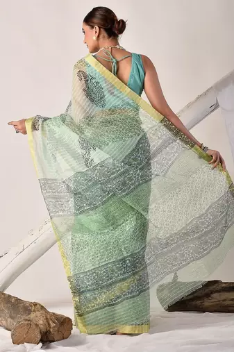 Green block printed pure kota doria floral  saree