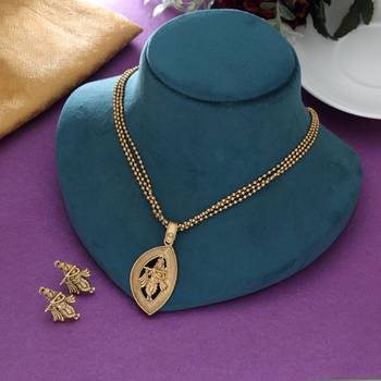 matte gold krishna pendant necklace set with earrings 2