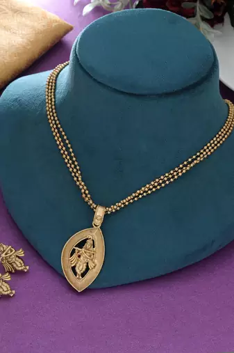 matte gold krishna pendant necklace set with earrings