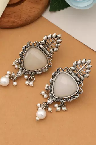 white alloy earrings with stone dangle design