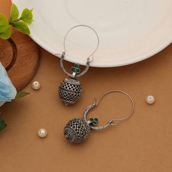 green alloy earrings with oxidised stone drop design 1