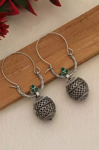 green alloy earrings with oxidised stone drop design