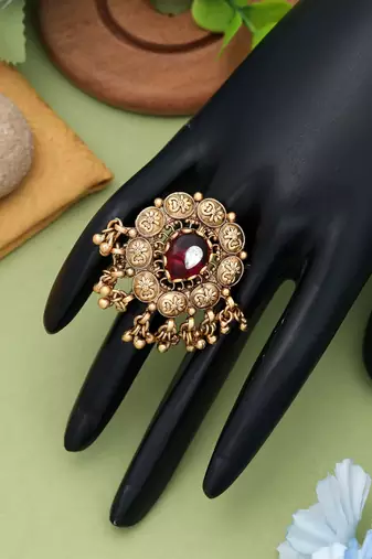 red alloy ring with gold plated stone design