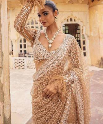 Beige embroidered work net saree 2