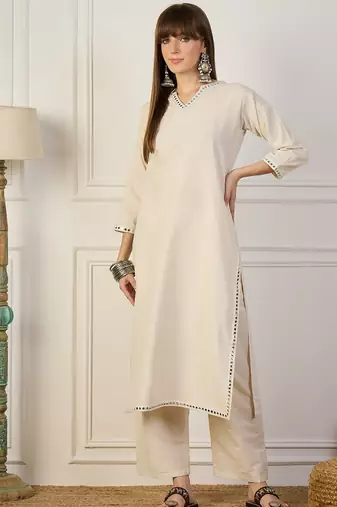 Off white color beautiful looking rich party kurta set
