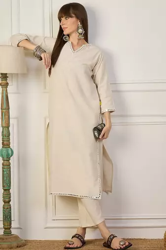 Off white color beautiful looking rich party kurta set