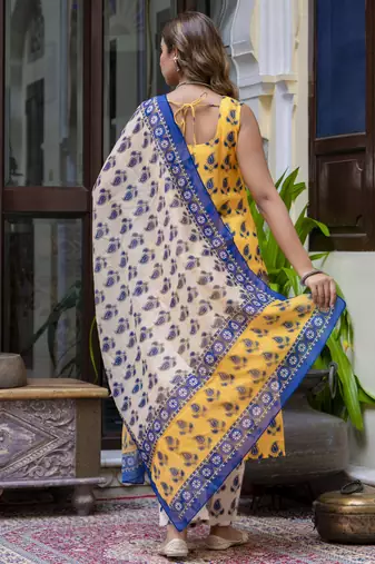 Yellow color cotton blended floral printed partywear suit