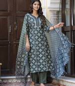 Green color cotton blended designer floral printed ethnic partywear suit