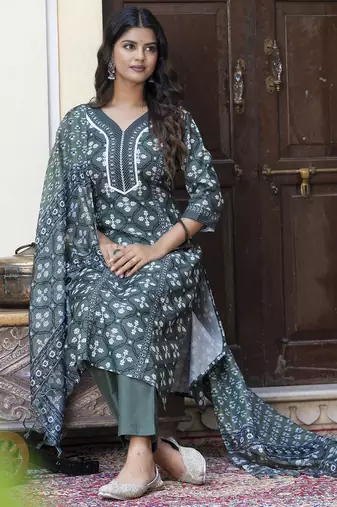 Green color cotton blended floral printed partywear suit