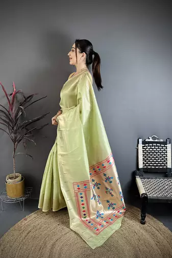 Light green tissue solid zari weaving paithani saree with muniya border