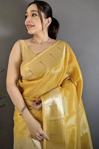 Golden yellow tissue solid zari weaving paithani saree with muniya border