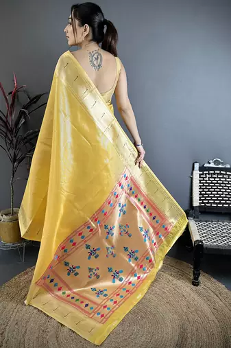 Golden yellow tissue solid zari weaving paithani saree with muniya border