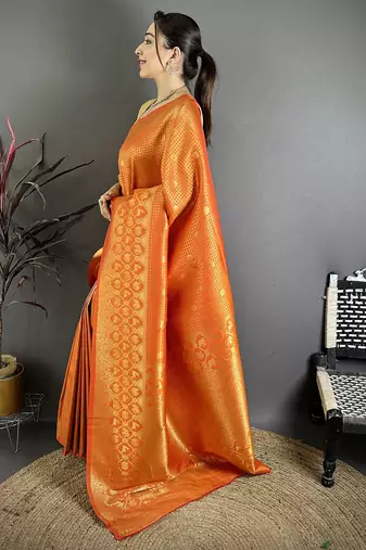 Orange banarasi soft silk checked body with floral motifs south pattu saree